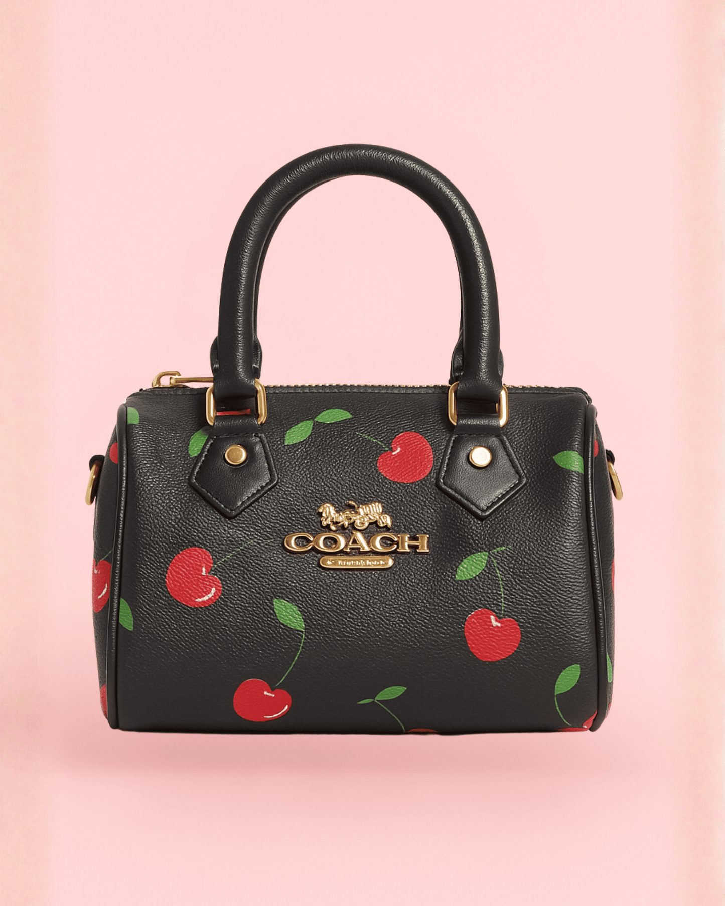 Sleek black Coach inspired mini bag with bold red cherry print and gold luxe hardware, vintage-inspired aesthetic.