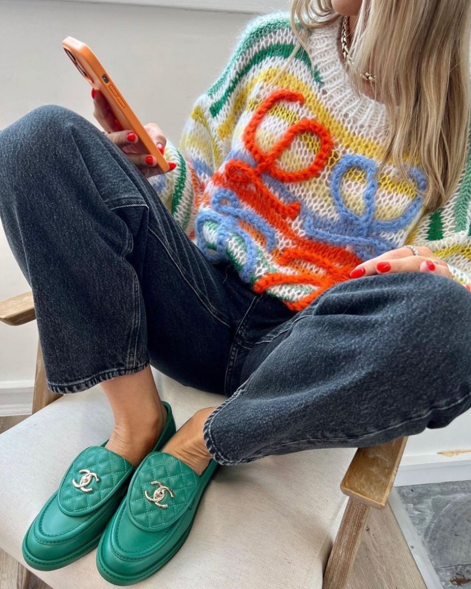  Loewe Knit in Confetti styled with dark denim jeans and green loafers for a bold, aesthetic look.