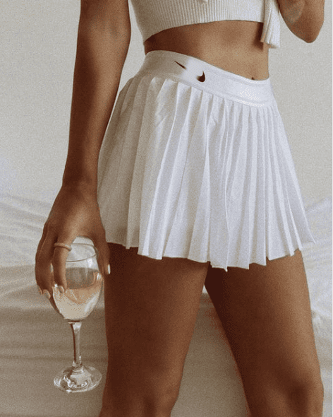  Classic white Nike pleated tennis skirt, the perfect high-performance and aesthetic choice for padel matches in Lebanon.